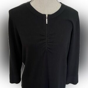 Black cashmere-like sweater with rhinestone toggle